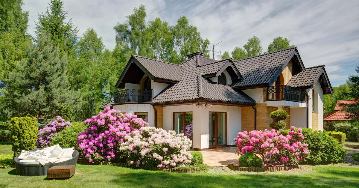 A beautiful home in the Spring with flowering blooms.